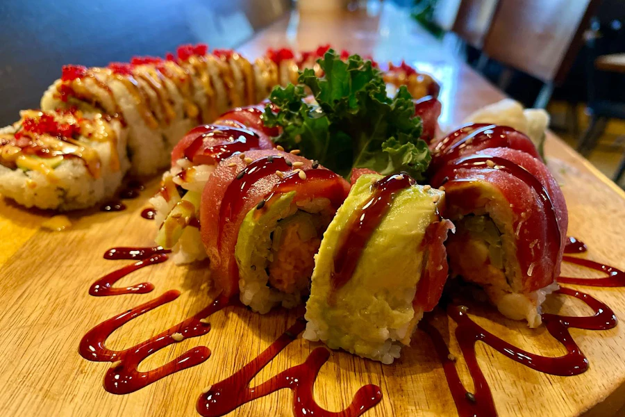 Kin Sushi & Thai Cuisine Corporate Catering and Group Ordering located at 1132 N Milwaukee Ave, Chicago, IL 60642, USA. Kin Sushi & Thai Cuisine's top menu items include Combination Sushi Roll Box, Fried Rice Boxed Lunch, Spicy Basil Boxed Lunch.