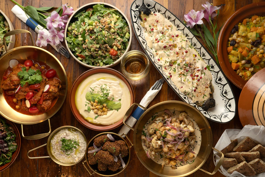 Hummus Kitchen Corporate Catering and Group Ordering located at 1 Dutch St, New York, NY 10038, USA. Hummus Kitchen's top menu items include Full Tray of Whole Charred Eggplant, Full Tray of Chicken Shawarma, Full Tray of Cauliflower.