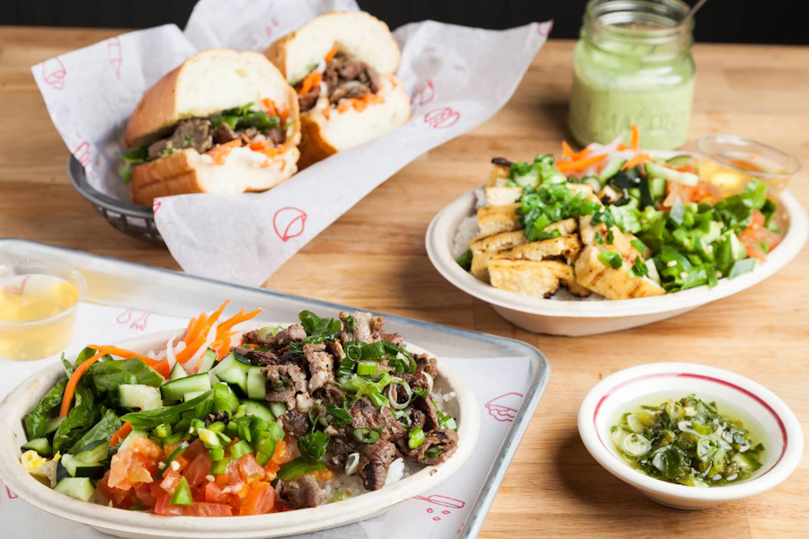 Sizzle and Crunch Corporate Catering and Group Ordering located at 2800 Southcenter Mall, Tukwila, WA 98188, USA. Sizzle and Crunch's top menu items include Grilled Chicken Rice Bowl, Tofu Rice Bowl, Grilled Pork Banh Mi.