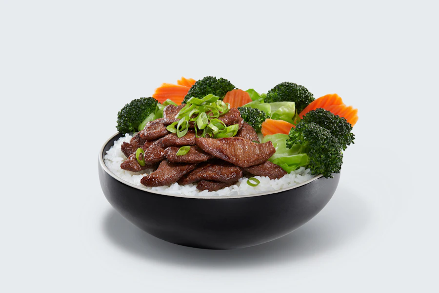 WaBa Grill Corporate Catering and Group Ordering located at 14551 Newport Ave, Tustin, CA 92780, USA. WaBa Grill's top menu items include Chocolate Chunk Cookie, Assorted Individual Sodas, Chicken Veggie Bowl - Signature WaBa Way.